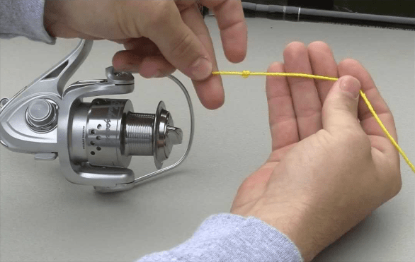 The bail and attach the fishing line to your rod